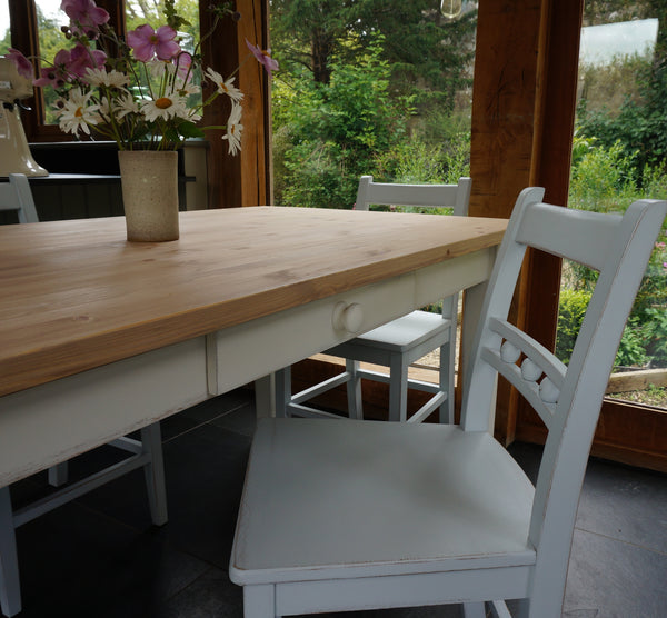 painted table and ball back chairs